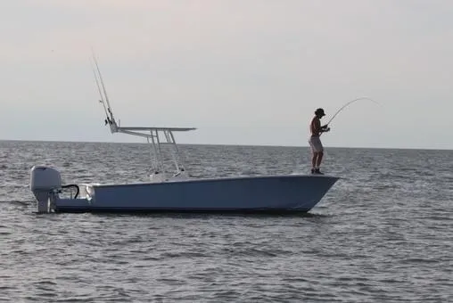 Slide: The Image of 2019 Albemarle CAPPS Custom Center Console boat with person fishing on open water. - 12