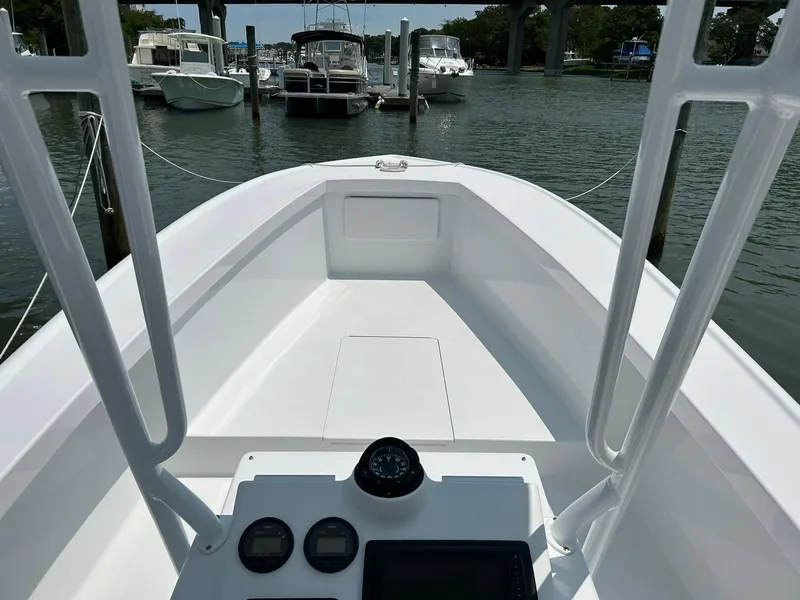 Slide: The Image of 2019 Albemarle CAPPS Custom Center Console boat docked at a marina. - 7