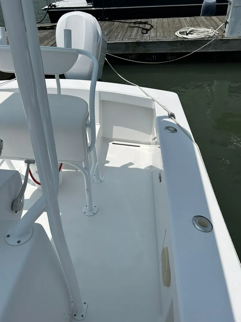 Slide: The Image of 2019 Albemarle CAPPS Custom Center Console boat docked at marina. - 9