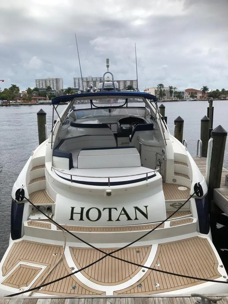 Slide: The Image of 2003 Sunseeker Portofino 46 yacht docked at a marina. - 21