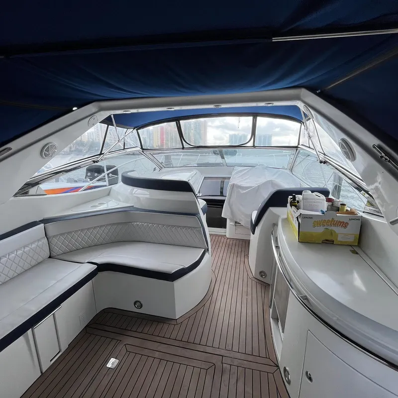 Slide: The Image of Interior of 2003 Sunseeker Portofino 46 yacht with seating and wooden flooring. - 25