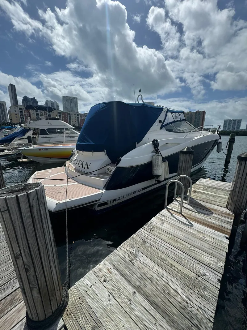 Slide: The Image of 2003 Sunseeker Portofino 46 yacht docked at a marina on a sunny day. - 5
