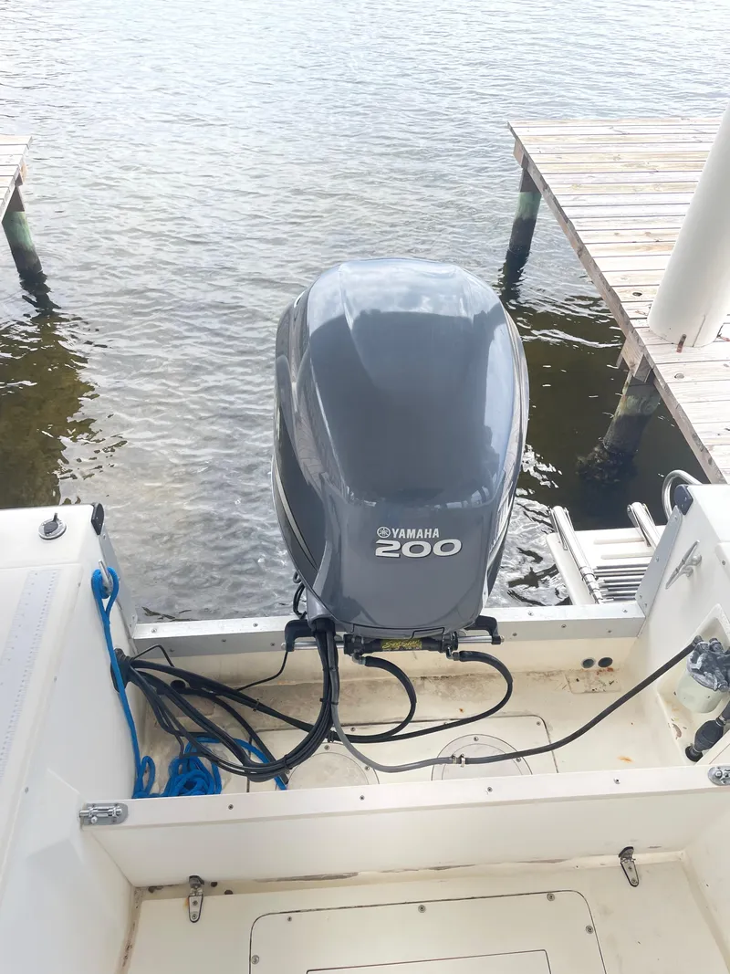 Slide: The Image of 1992 Mako 221 CC boat with Yamaha 200 outboard motor at dock. - 17