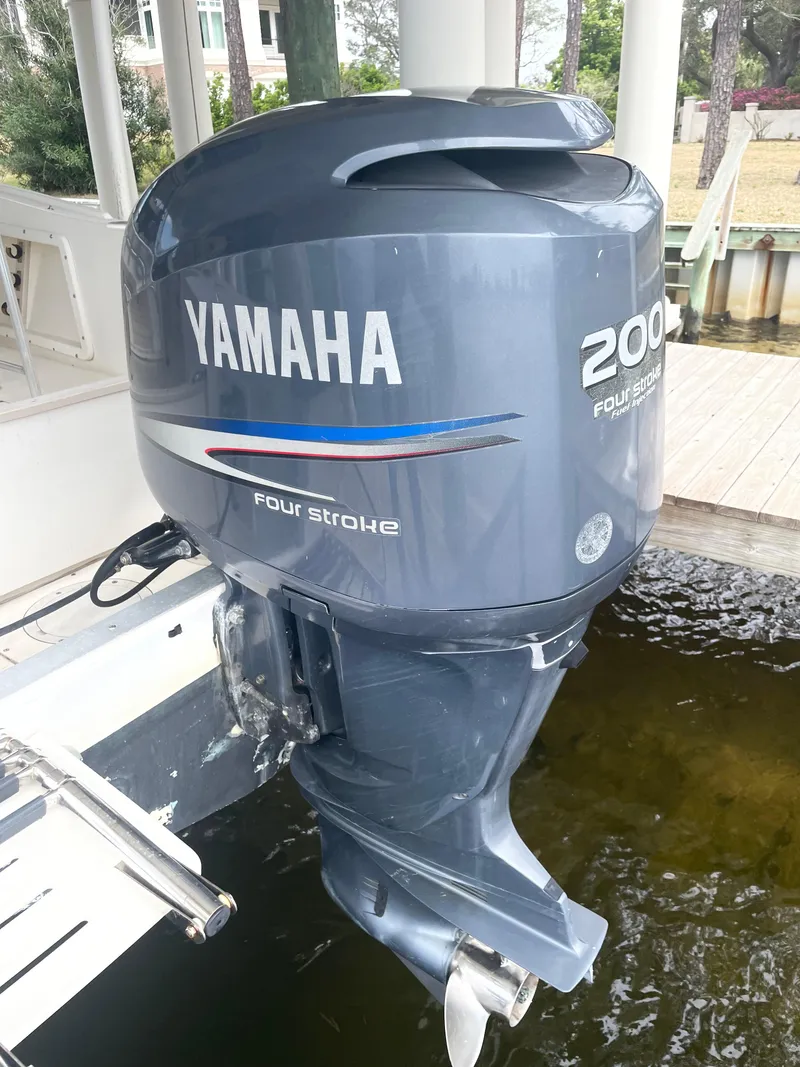 Slide: The Image of Yamaha 200 HP four-stroke outboard motor on a 1992 Mako 221 CC boat. - 18