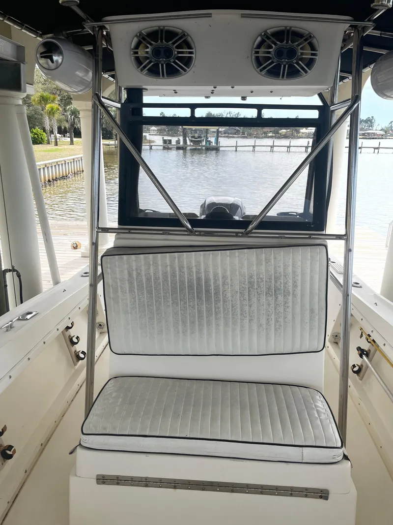 Slide: The Image of 1992 Mako 221 CC boat interior with seating and speakers. - 9