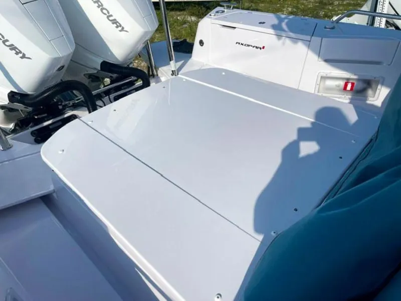 Slide: The Image of 2024 Axopar 37 Sun Top boat with Mercury engines, rear deck view. - 4