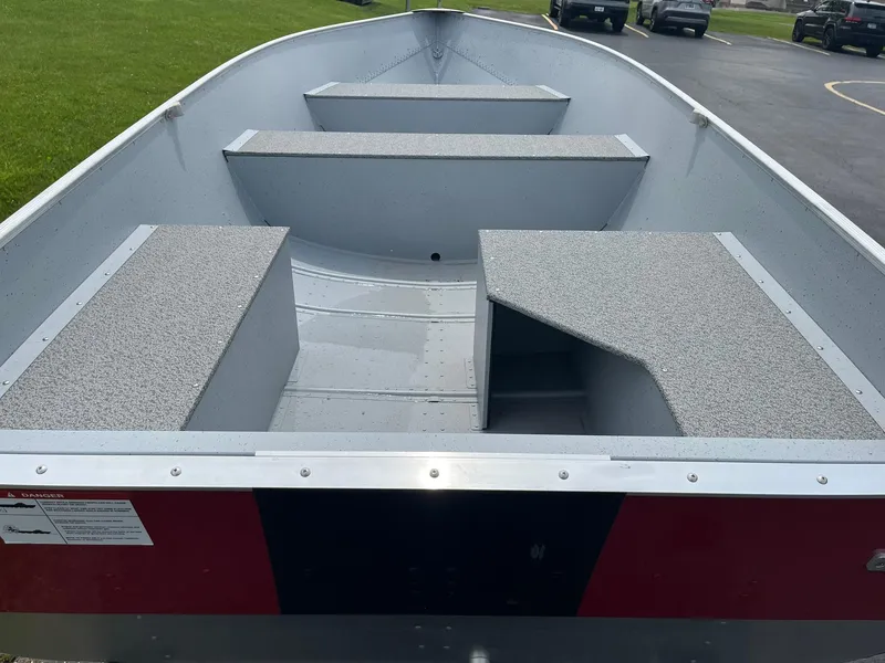 Slide: The Image of 2024 Lund WC-14 aluminum fishing boat interior with bench seats. - 5