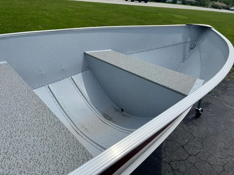 Slide: The Image of 2024 Lund WC-14 aluminum fishing boat interior with bench seats. - 9