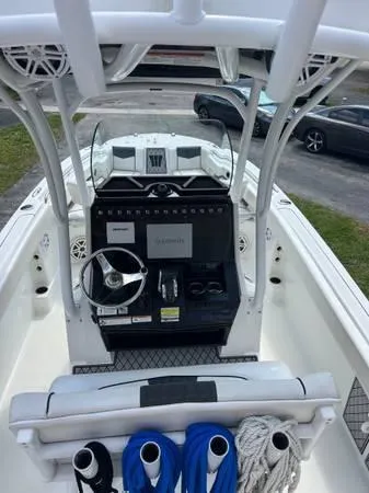 Slide: The Image of 2021 Wellcraft 222 Fisherman boat cockpit with Garmin navigation system. - 3