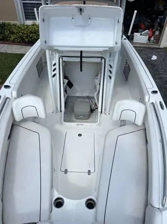 Slide: The Image of 2021 Wellcraft 222 Fisherman boat interior with open storage compartment. - 4