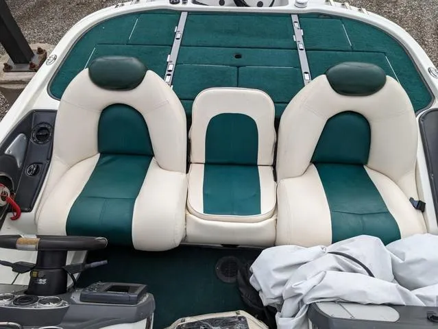 Slide: The Image of 2008 Ranger Comanche Z19 boat interior with green and white seats. - 11