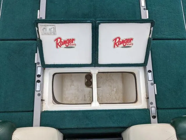Slide: The Image of 2008 Ranger Comanche Z19 boat storage compartment with Ranger Boats logo. - 15