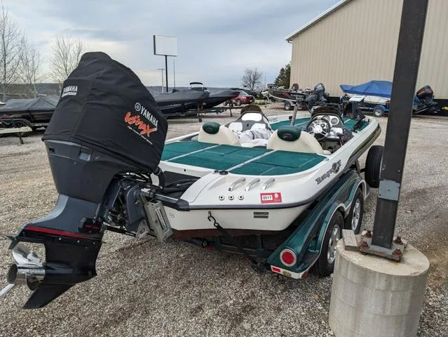 Slide: The Image of 2008 Ranger Comanche Z19 boat with Yamaha motor in a storage yard. - 3