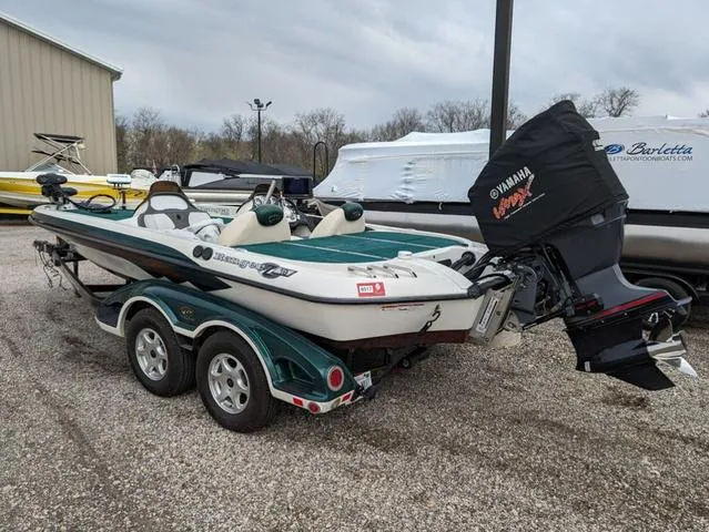 Slide: The Image of 2008 Ranger Comanche Z19 boat with Yamaha motor in a marina. - 4