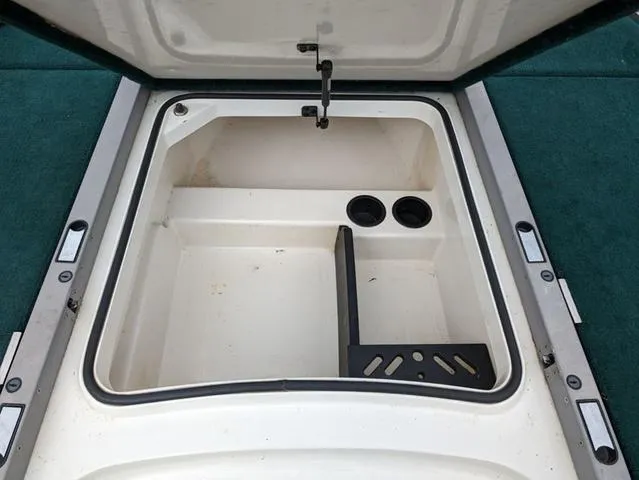 Slide: The Image of Open storage compartment of a 2008 Ranger Comanche Z19 boat. - 9
