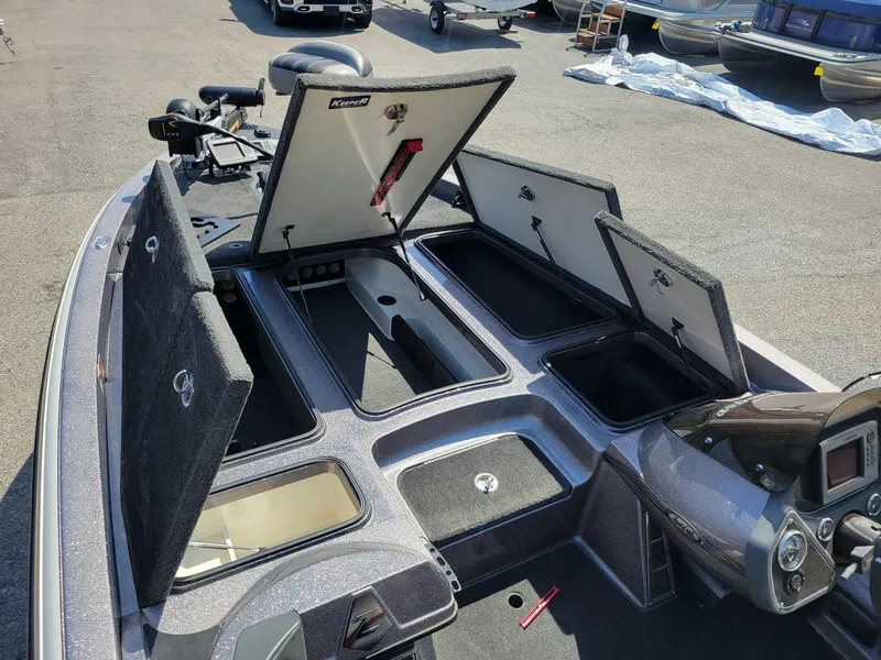 Slide: The Image of Open storage compartments on a 2011 Ranger Z521 boat with Mercury 250 Pro XS engine. - 14