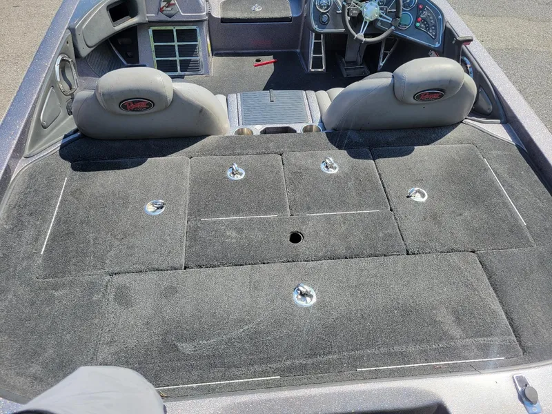 Slide: The Image of 2011 Ranger Z521 boat interior with steering wheel and storage compartments. - 18