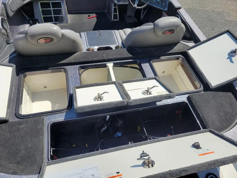 Slide: The Image of Interior of 2011 Ranger Z521 boat showing storage compartments and seating. - 19