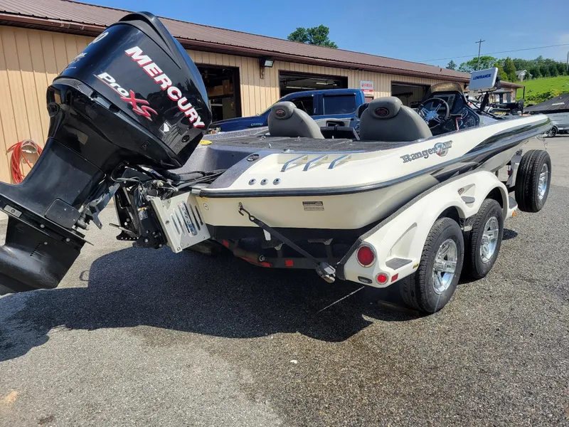 Slide: The Image of 2011 Ranger Z521 boat with Mercury 250 Pro XS engine on trailer. - 2
