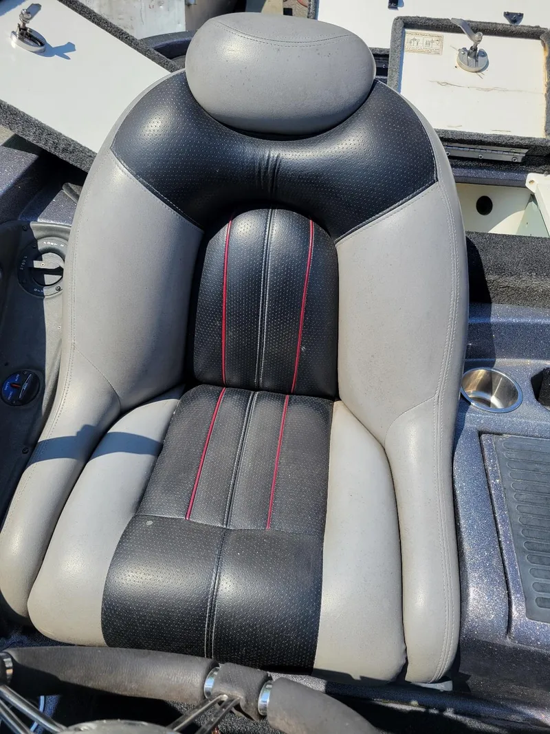Slide: The Image of Comfortable seat in a 2011 Ranger Z521 boat, featuring black and gray upholstery. - 7