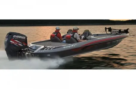 Slide: The Image of 2011 Ranger Z521 boat with Evinrude engine speeding on water at sunset. - 9