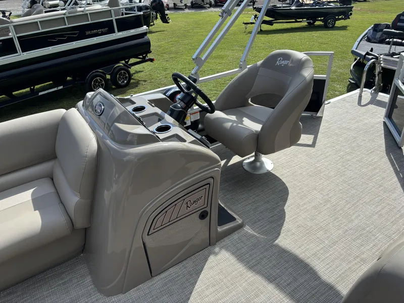 Slide: The Image of 2024 Ranger 200C boat interior with steering console and seating on display. - 11