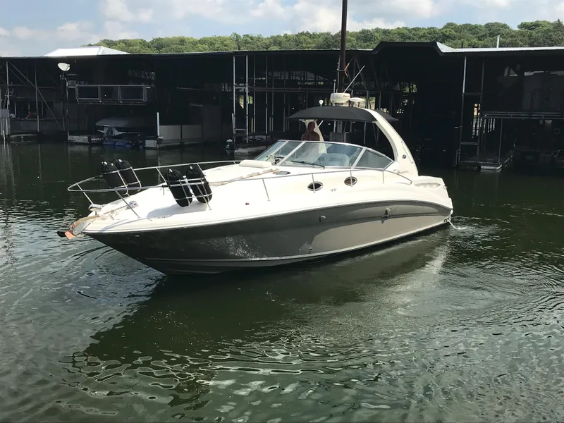 Slide: The Image of 2007 Sea Ray 320 Sundancer boat docked in a marina. - 2