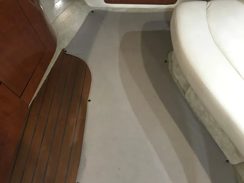 Slide: The Image of Interior of 2007 Sea Ray 320 Sundancer with wood and carpet flooring. - 20