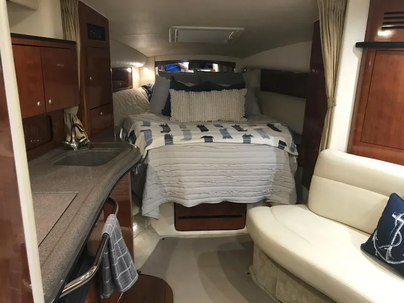 Slide: The Image of Interior of 2007 Sea Ray 320 Sundancer with cozy bed and kitchenette. - 22