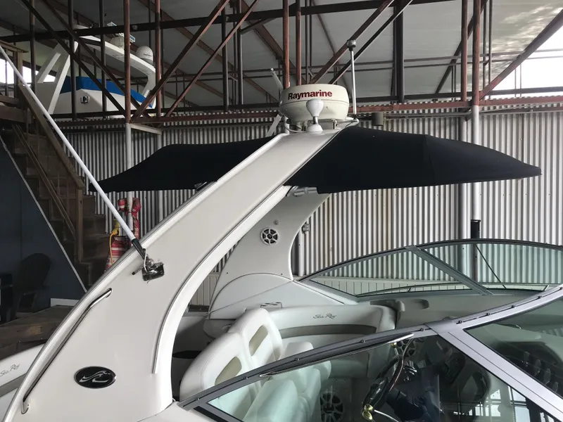 Slide: The Image of 2007 Sea Ray 320 Sundancer boat with Raymarine equipment in a storage facility. - 8