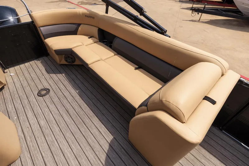 Slide: The Image of Luxurious seating on 2022 Harris 230 Cruiser pontoon boat with tan upholstery. - 16