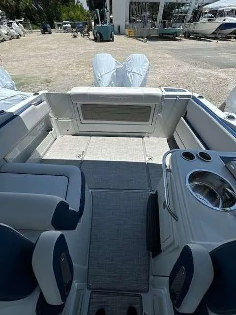 Slide: The Image of 2024 Crownline 280 DC boat interior with seating and sink. - 9