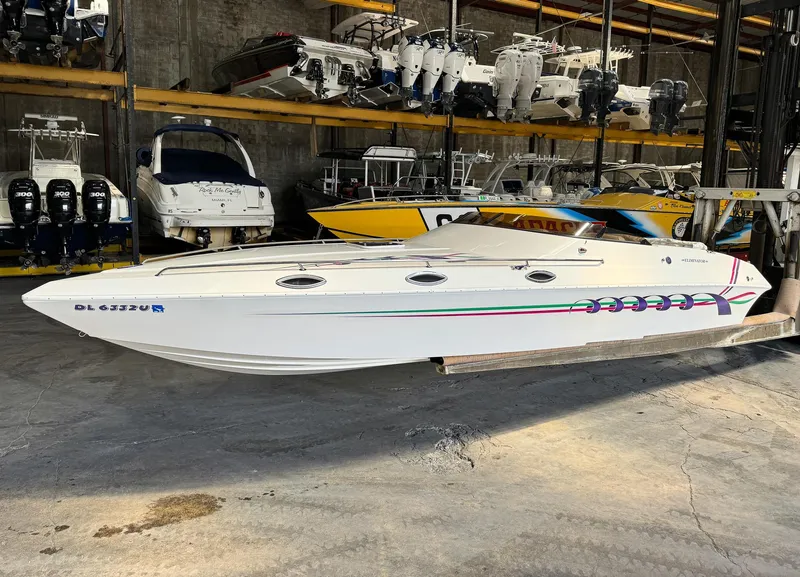 Slide: The Image of 1998 Eliminator 280 Eagle XP speedboat in storage facility. - 1