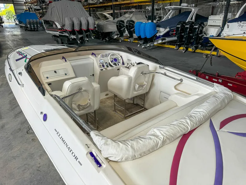 Slide: The Image of 1998 Eliminator 280 Eagle XP speedboat interior in a storage facility. - 10