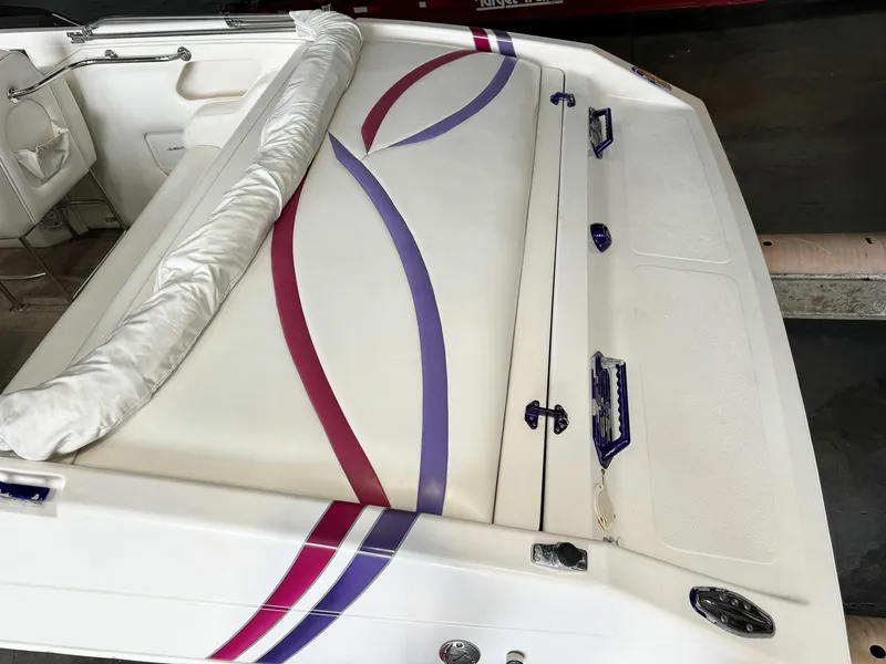 Slide: The Image of 1998 Eliminator 280 Eagle XP boat with white, purple, and pink accents. - 11