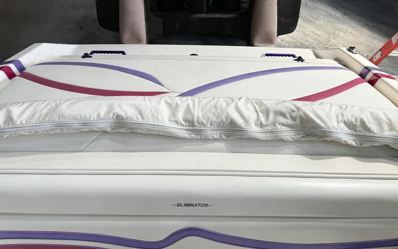 Slide: The Image of 1998 Eliminator 280 Eagle XP boat with white, purple, and pink upholstery. - 13