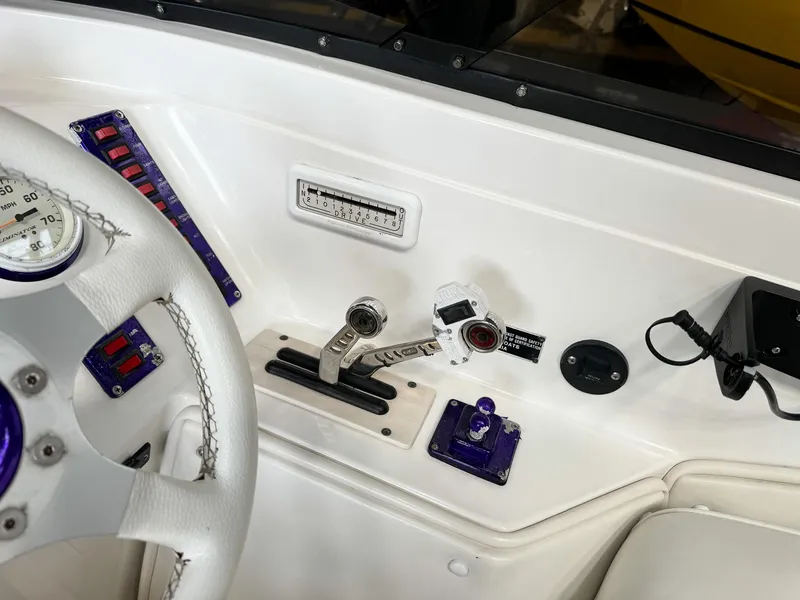 Slide: The Image of 1998 Eliminator 280 Eagle XP boat dashboard with controls and gauges. - 29