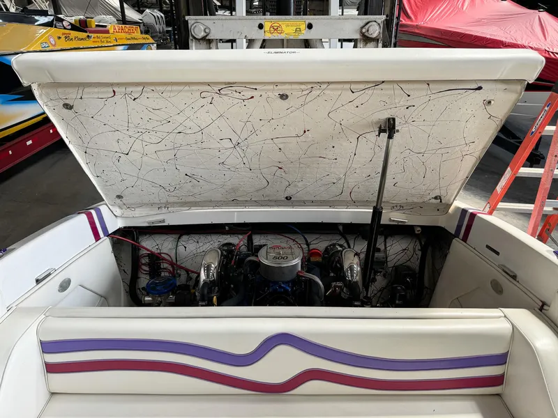 Slide: The Image of 1998 Eliminator 280 Eagle XP boat engine compartment with open hatch. - 32