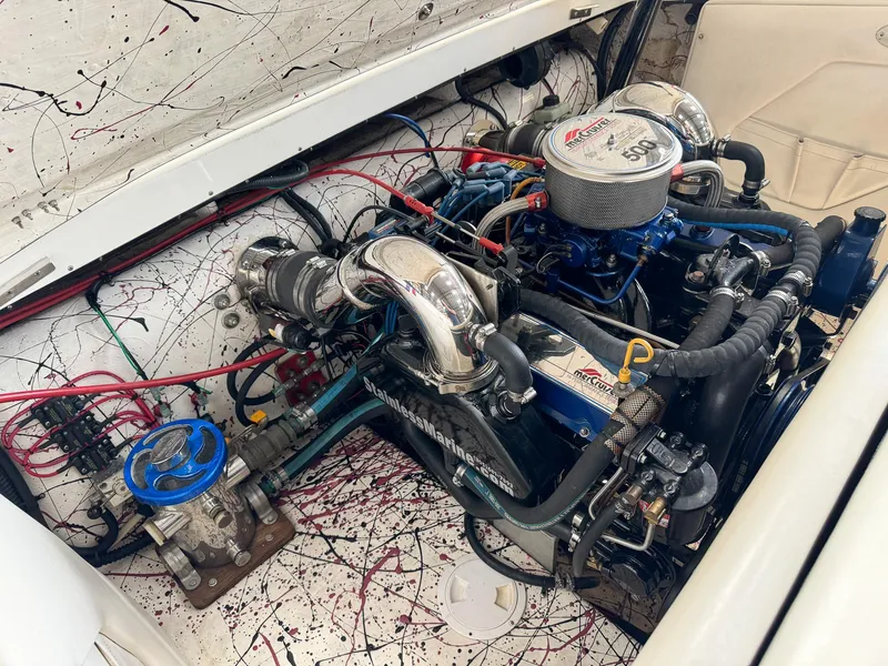 Slide: The Image of 1998 Eliminator 280 Eagle XP engine compartment with dual carburetors and chrome components. - 34