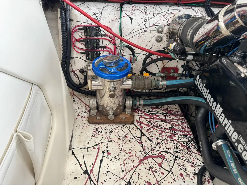 Slide: The Image of Engine compartment of a 1998 Eliminator 280 Eagle XP boat with visible wiring and components. - 37