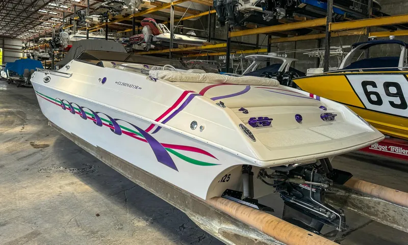 Slide: The Image of 1998 Eliminator 280 Eagle XP speedboat in storage facility. - 6