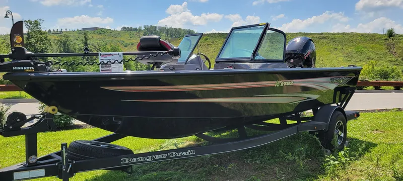 Slide: The Image of 2024 Ranger VS1782SC Reata boat on trailer, parked outdoors under a clear blue sky. - 1
