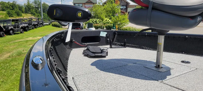 Slide: The Image of 2024 Ranger VS1782SC Reata boat interior with seating and equipment on a sunny day. - 2