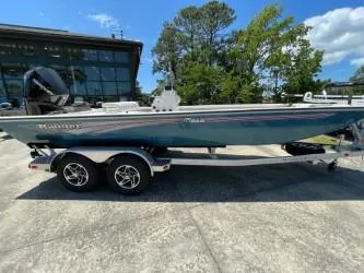 The Image of 2024 Ranger RB210 boat on trailer, parked outdoors. - 0