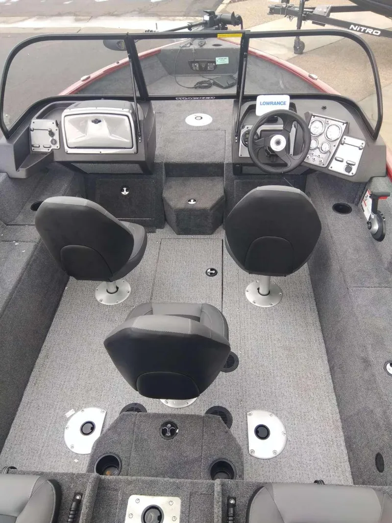 Slide: The Image of 2024 Tracker Pro Guide V-175 Combo boat interior with seating and control panel. - 2