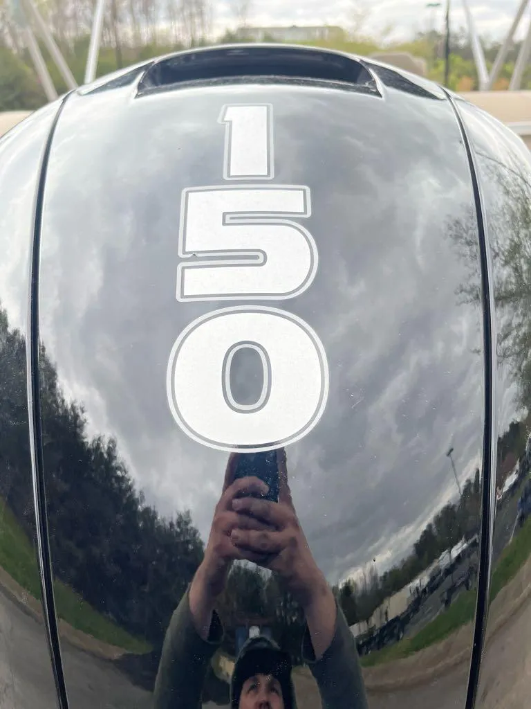 Slide: The Image of 2024 Sun Tracker Party Barge 24 DLX interior with beige seating and spacious layout. - 3