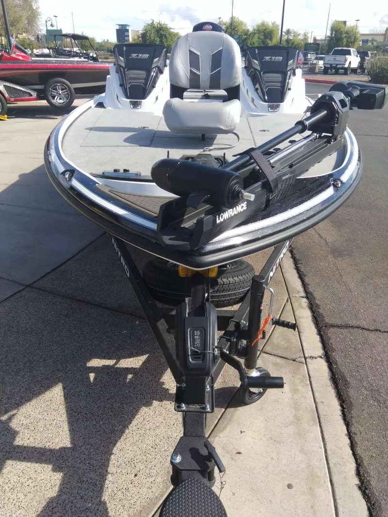 Slide: The Image of 2024 Nitro Z18 Pro fishing boat with Lowrance equipment, parked on a trailer. - 2