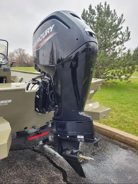 Slide: The Image of 2024 Tracker Grizzly 2072 CC boat with Mercury outboard motor. - 2