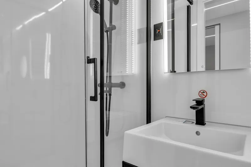 Slide: The Image of Modern bathroom in 2024 Waterlodge Apart EL with sleek shower and sink. - 10