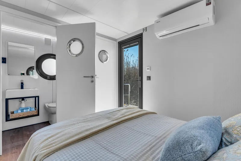 Slide: The Image of Modern bedroom in 2024 Waterlodge Apart EL with ensuite bathroom and air conditioning. - 6